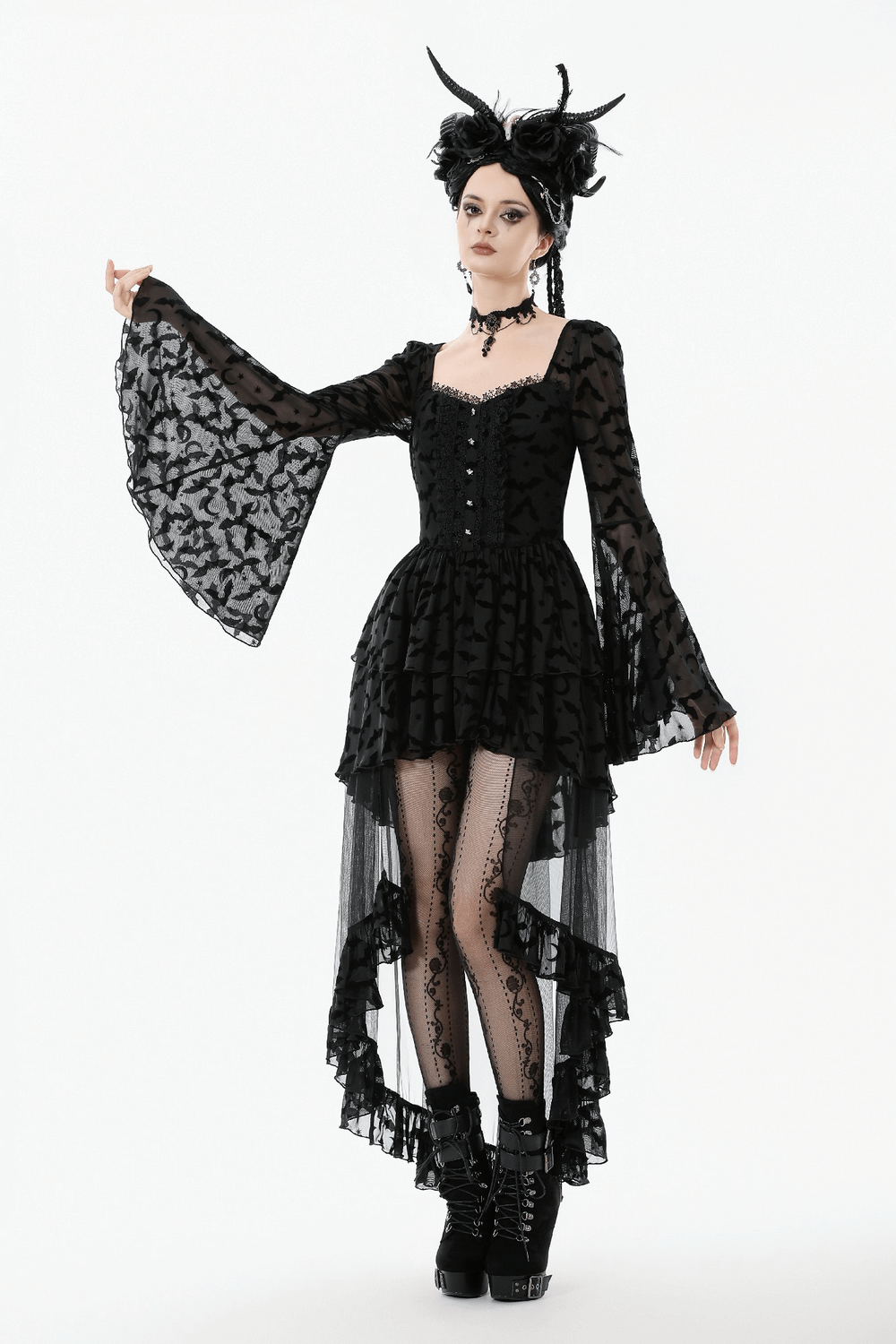 Black Gothic Bat Lace Dress with Sheer High-Low Hem worn by a model with flared sleeves and bat motifs.