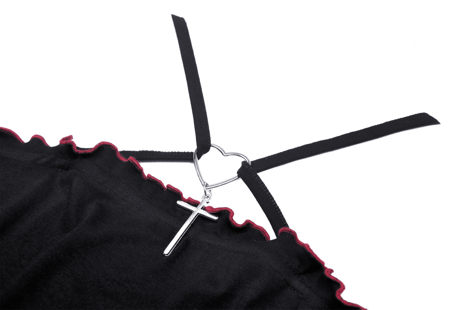 Close-up of the back design of a black gothic crop top featuring a heart and cross detail on straps.