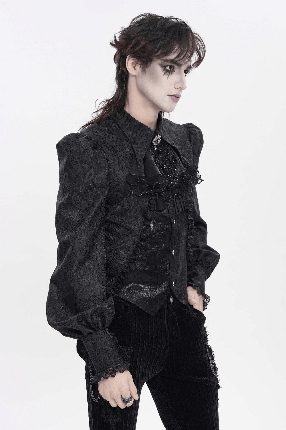 Model showcasing a Black Gothic Brocade Shirt with Ruffles and Lace featuring ruffled bib, lace cuffs, and puff sleeves.