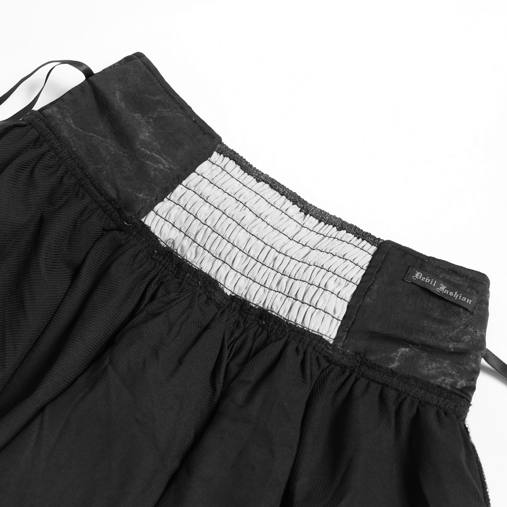 Black Gothic Corset Ruffle Mini Skirt with Chains, detailed view of the lace-up waistband and layered ruffles.