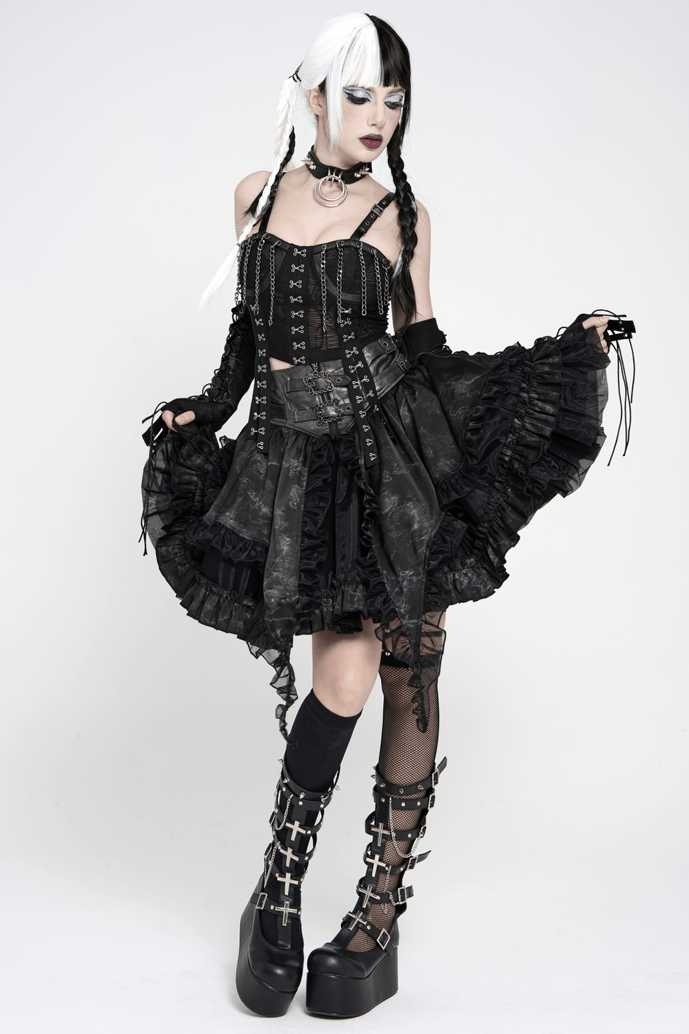 Black Gothic Corset Ruffle Mini Skirt with Chains showcased by a model in dramatic gothic fashion, complete with lace and layers.