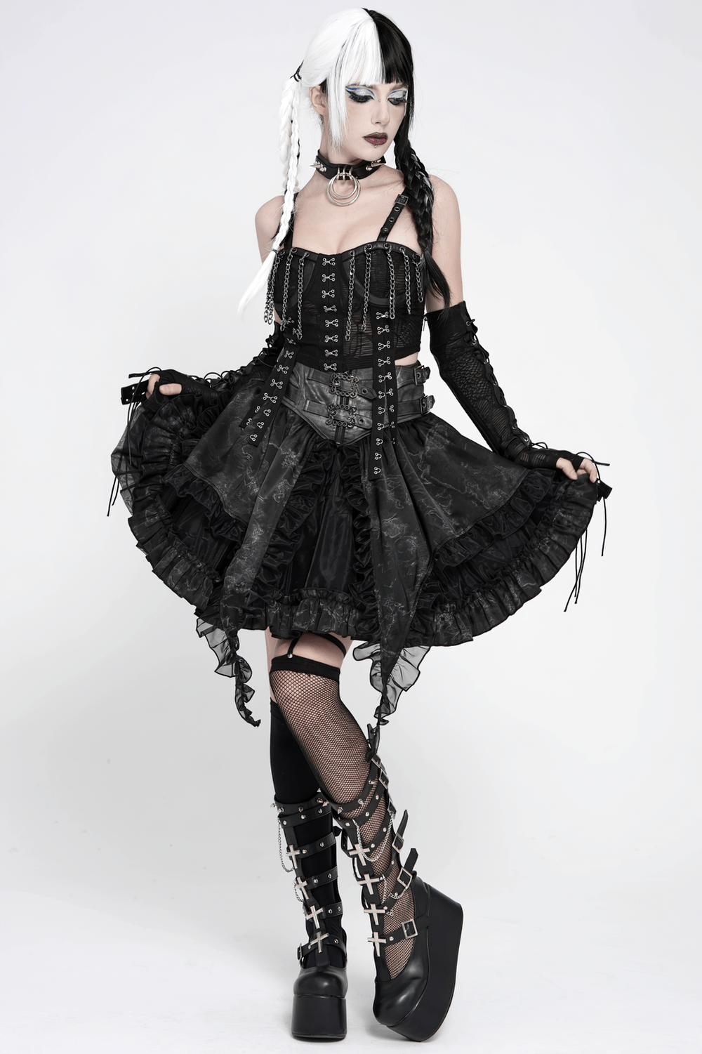 Black Gothic Corset Ruffle Mini Skirt with Chains modeled with layered ruffles, lace-up detail, and dramatic styling.