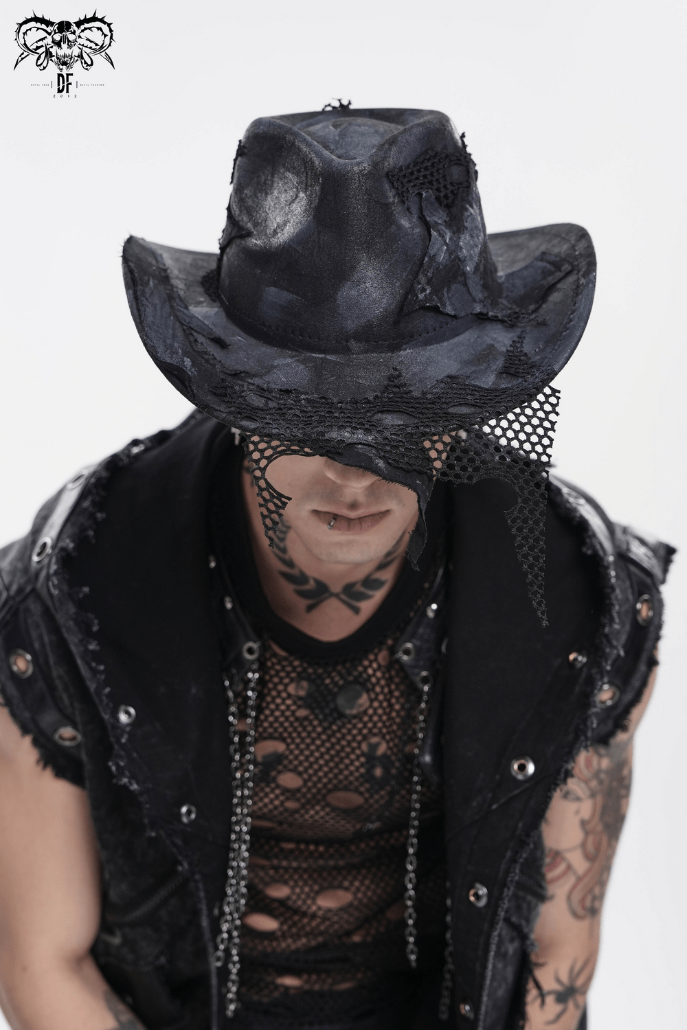 Black Gothic Cowboy Hat with Distressed Mesh Patch Details worn by a stylish model with tattoos.