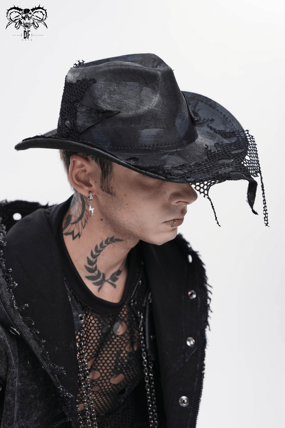 Black Gothic Cowboy Hat with Distressed Mesh Patch Details worn by a model with tattoos and a stylish outfit.