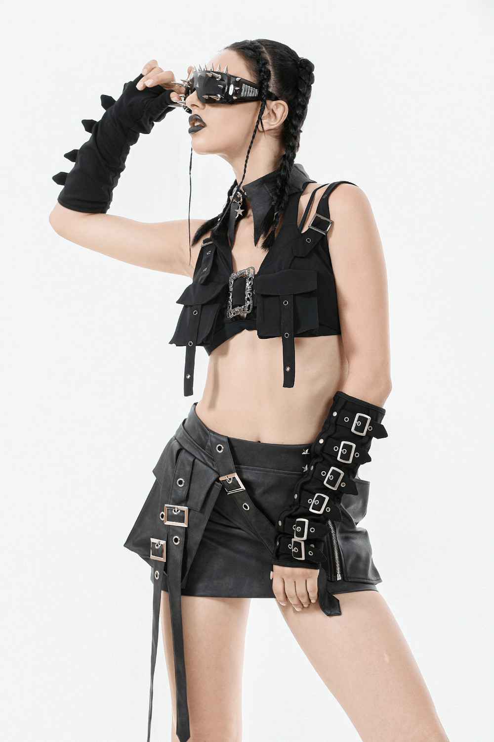 Black Gothic crop top with buckles, harness detail, and stylish accessories for an edgy look.