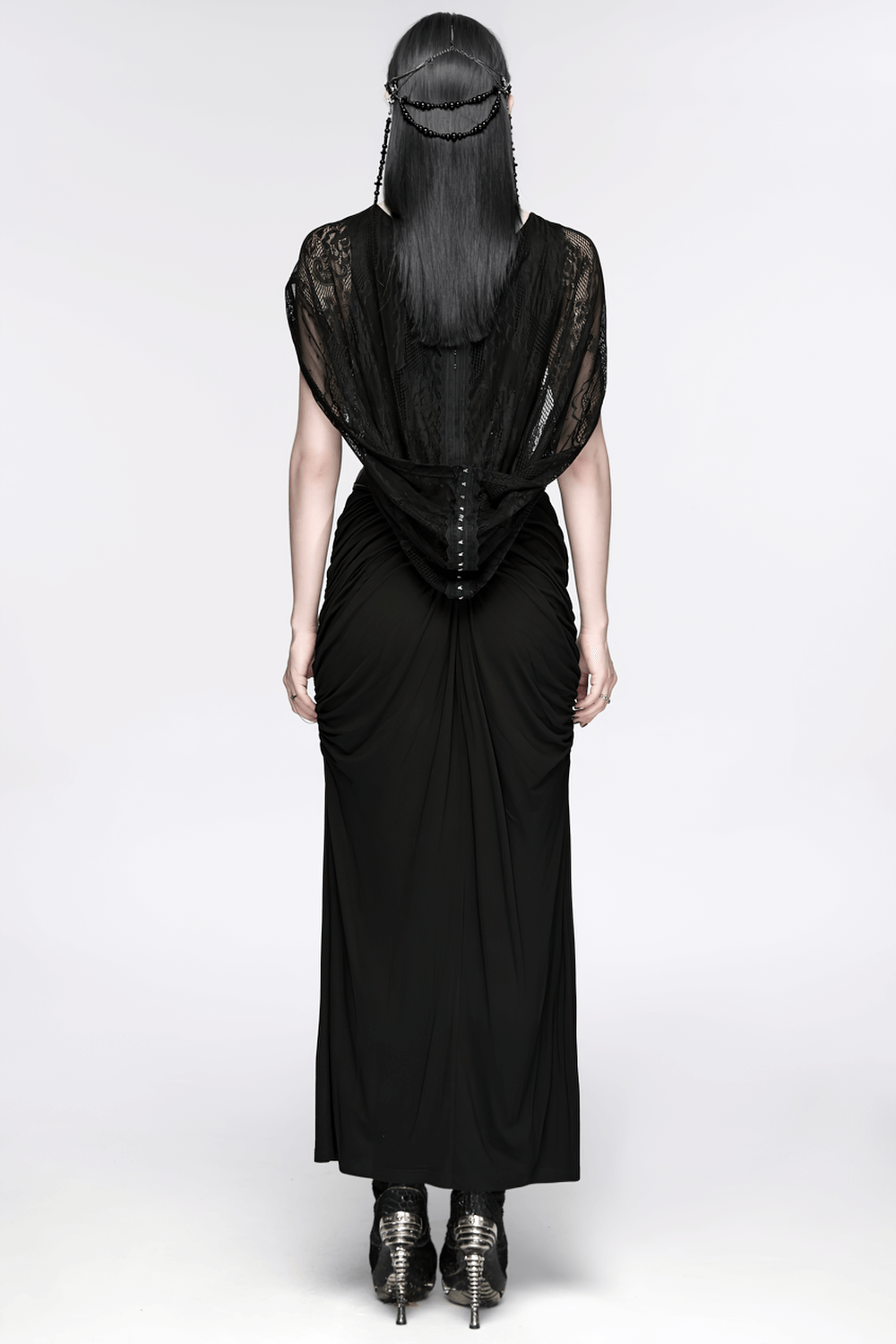 Alt Tag: Black Gothic Cross Tassel Chain Headpiece and Face Veil shown from back on model in black gown, chain veil drape
