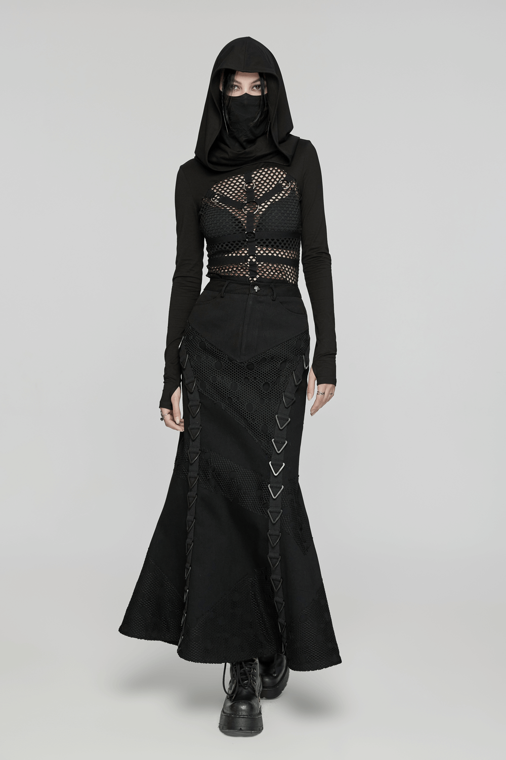 Black Gothic denim mesh skirt with triangular buckles, paired with a stylish black long-sleeve top.