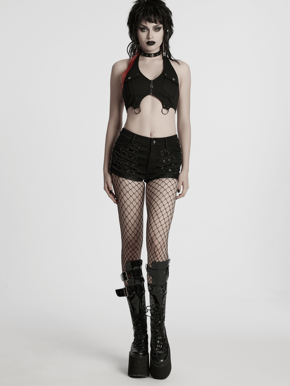 Black Gothic distressed denim shorts with eyelets, paired with fishnet stockings and platform boots.