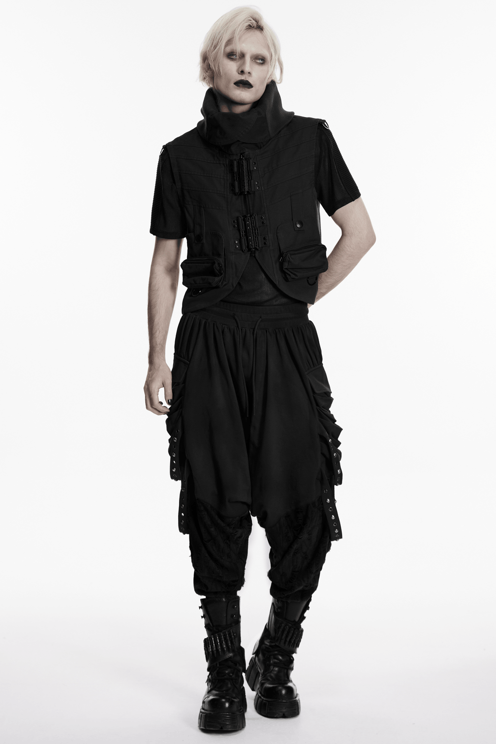 Black Gothic Drop-Crotch Pants with Studded Pockets paired with a stylish vest and combat boots, showcasing edgy post-apocalyptic fashion.