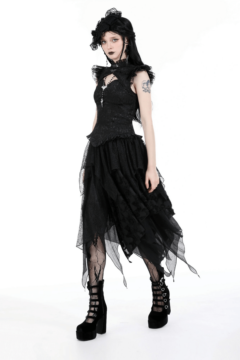 Models a black gothic embroidered top with cascading ruffles, offering a dramatic Victorian-inspired look.