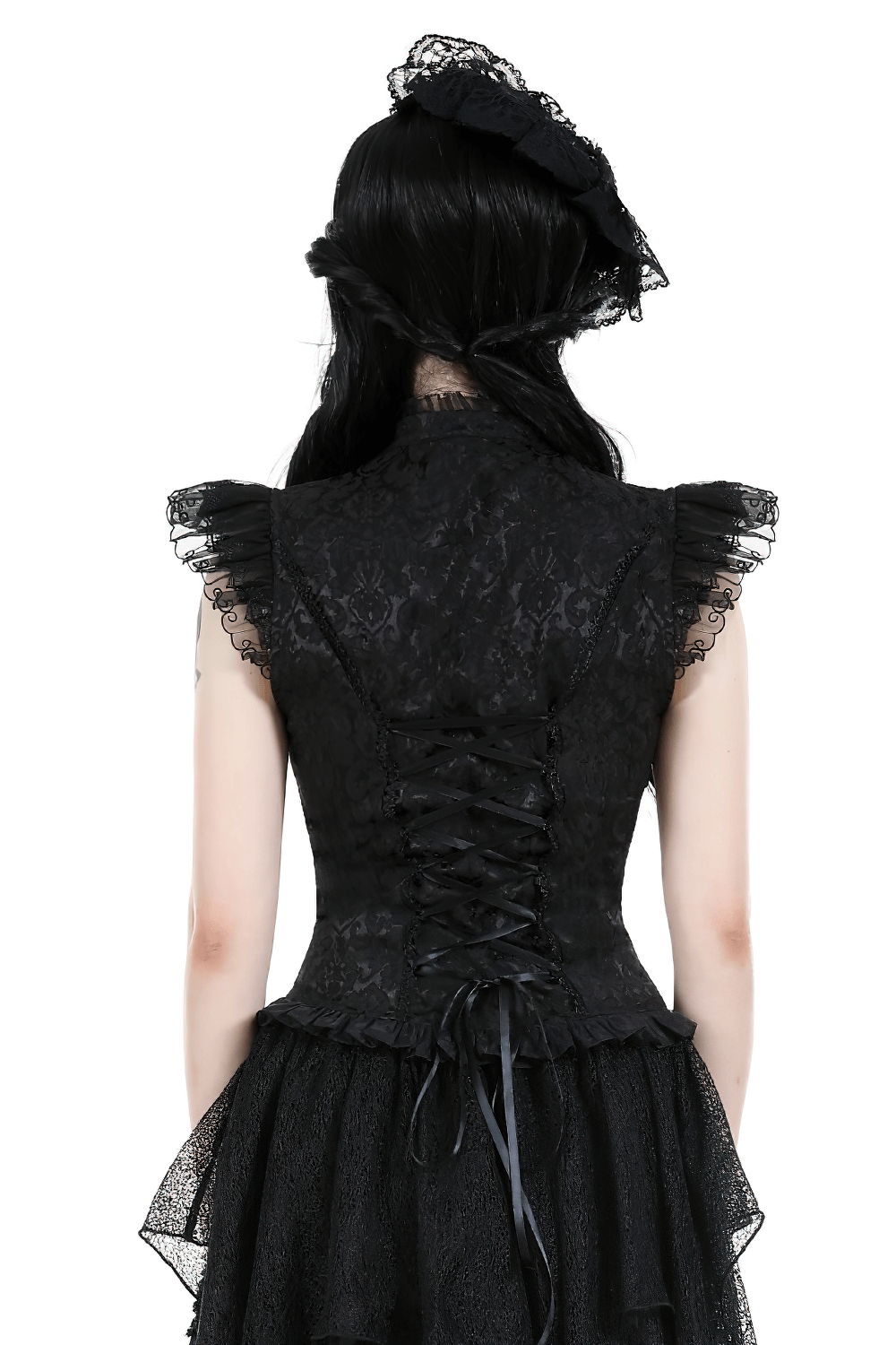 Back view of black Gothic embroidered top with cascading ruffles and lace detailing on shoulders.