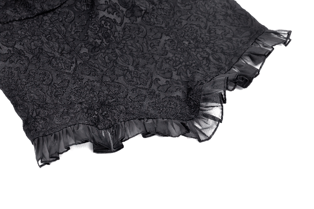Close-up of a black gothic lace top featuring intricate floral patterns and cascading ruffled sleeves for a dramatic look.