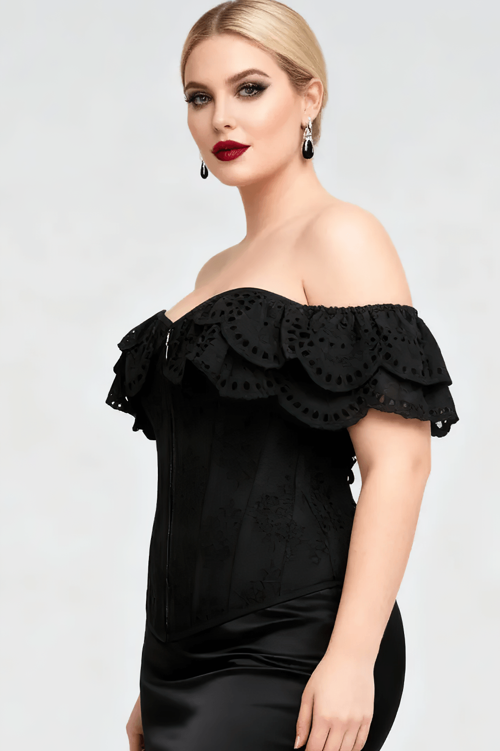 Black Gothic Eyelet Overbust Corset With Off Shoulder Ruffle, featuring elegant eyelet ruffles and a structured silhouette.