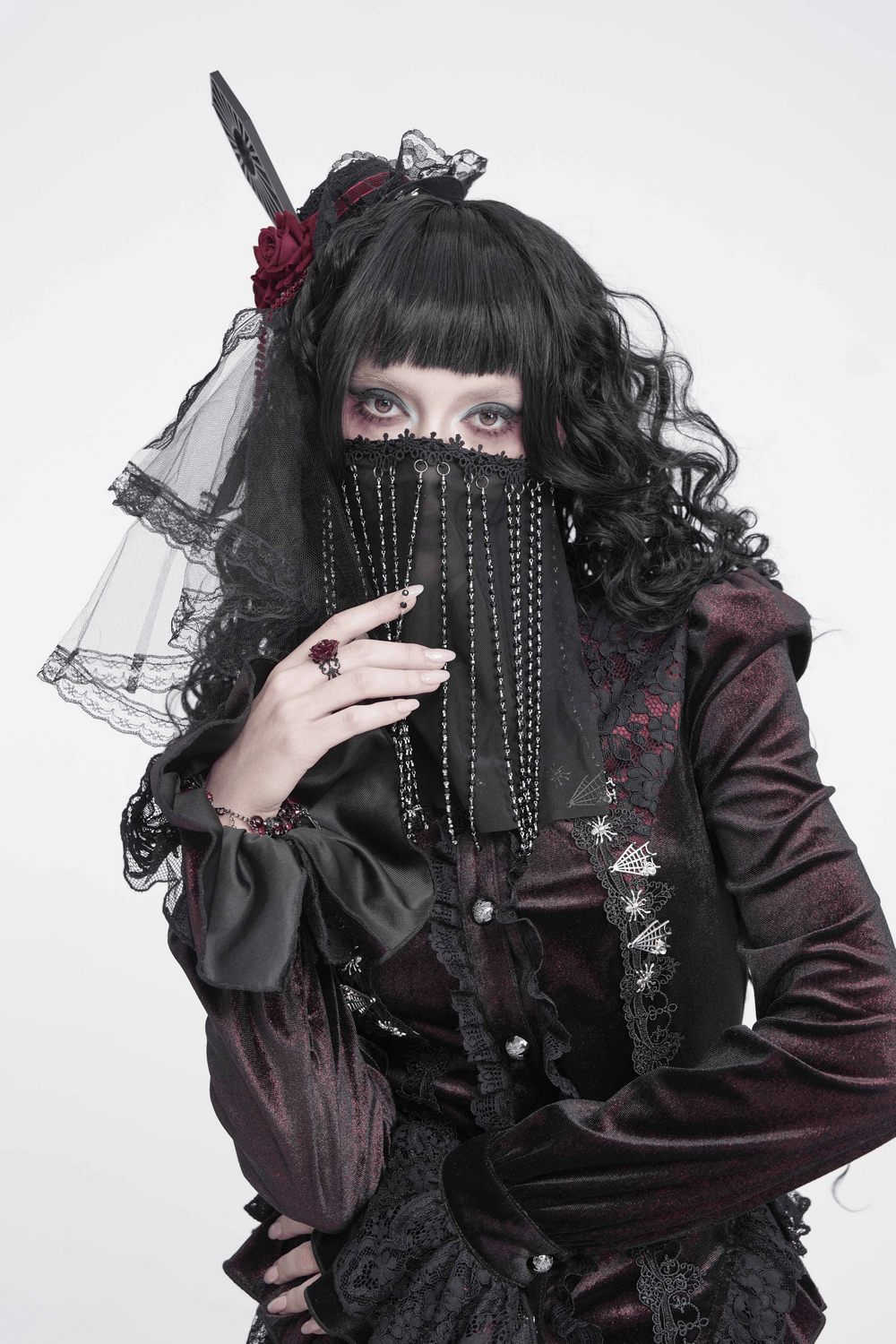 Black Gothic Face Veil Mask with Beaded Fringe worn by model in gothic fashion, showcasing elegance and style.