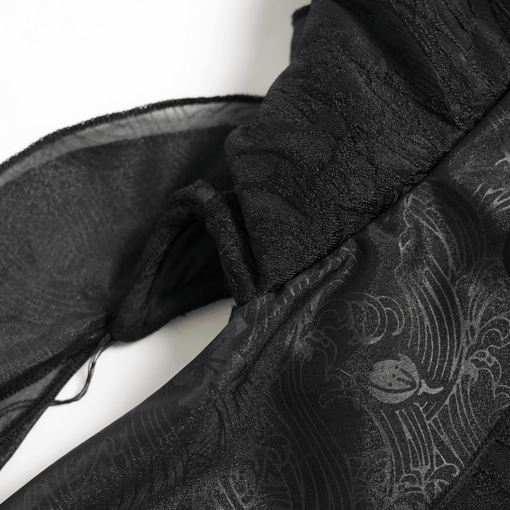 Alt Tag: Black Gothic Floral Lace-Up Corset Bustier Top close-up of sheer black ruffle and floral jacquard fabric, dark-romance texture detail