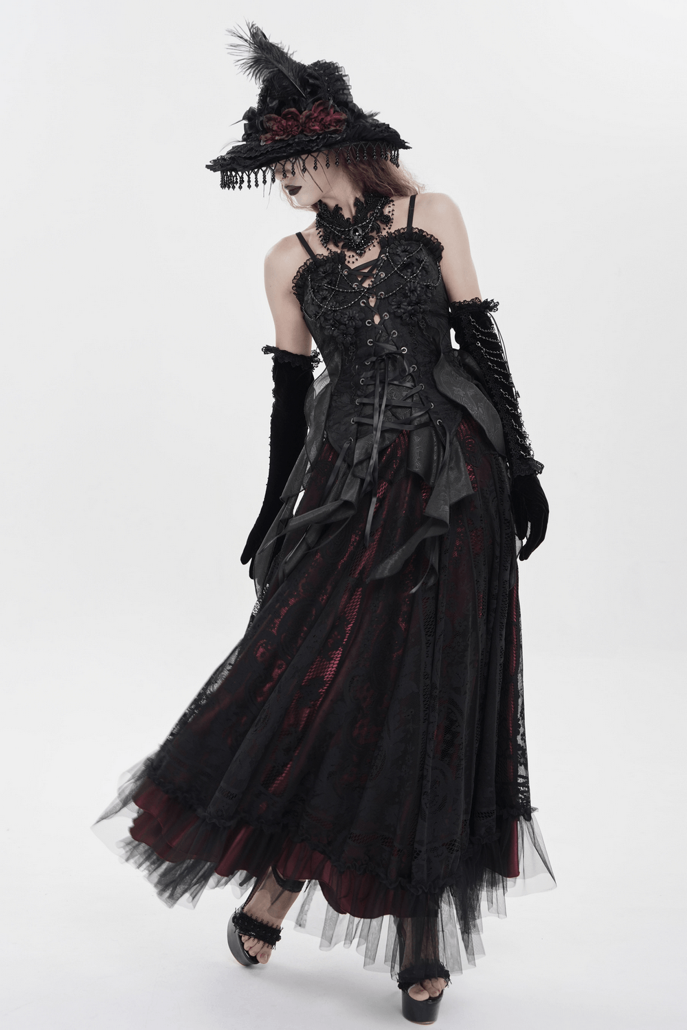 Alt Tag: Black Gothic Floral Lace-Up Corset Bustier Top styled in dark romantic black lace, corset bodice, feather hat, and layered tulle skirt