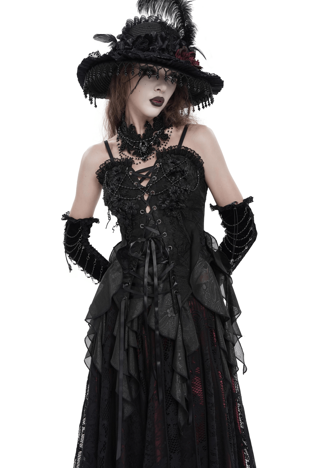 Alt Tag: Black Gothic Floral Lace-Up Corset Bustier Top worn with layered ruffle handkerchief hem and lace-up bodice, dark romantic look