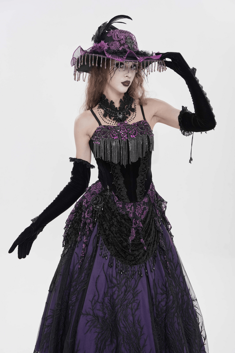 Alt Tag: Black Gothic Fringe Corset Bustier with Purple Lace worn with chain fringe, purple lace panels, and dramatic gothic festival styling