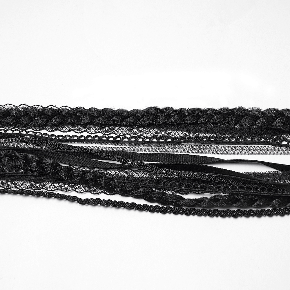 Black lace and braided strands for gothic hair accessories and styling.