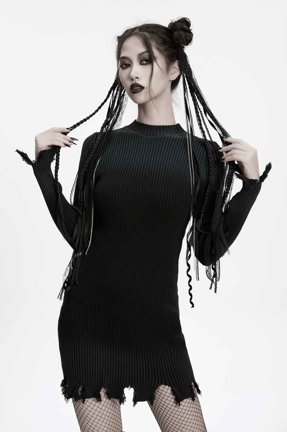 Gothic model wearing a black ribbed dress with intricate braided hair and striking makeup, embodying dark elegance.