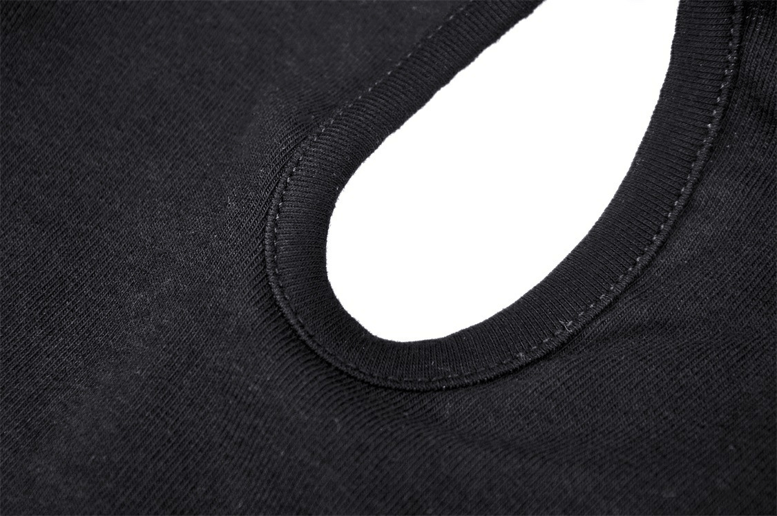 Close-up of the neck detail on a black gothic halter crop top showcasing the soft fabric and unique cutout.