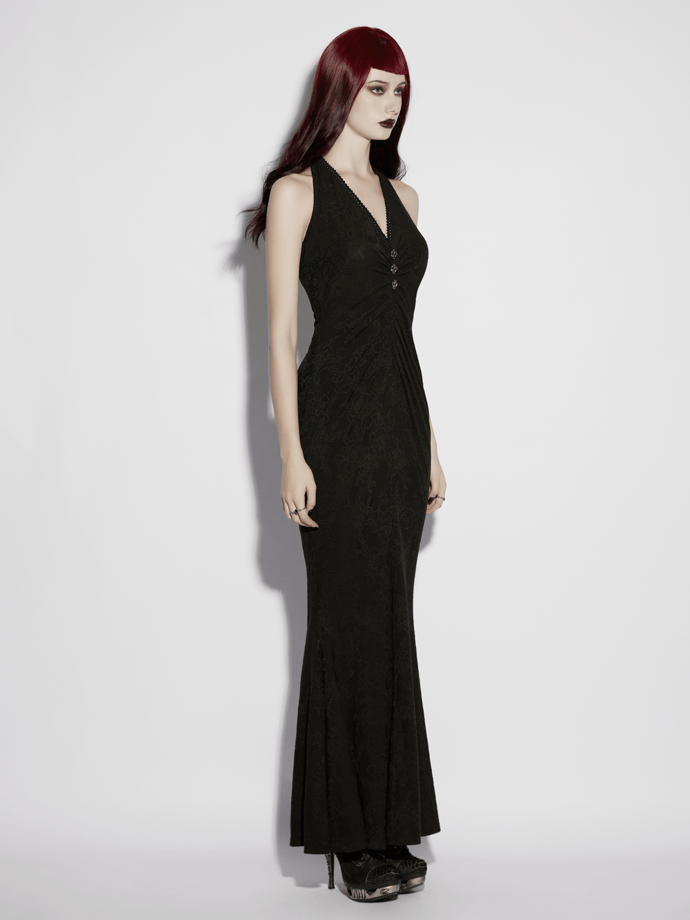 Alt Tag: Black Gothic Halter Jacquard Mermaid Maxi Dress on model, black halter neck rose jacquard fishtail evening gown with buckles