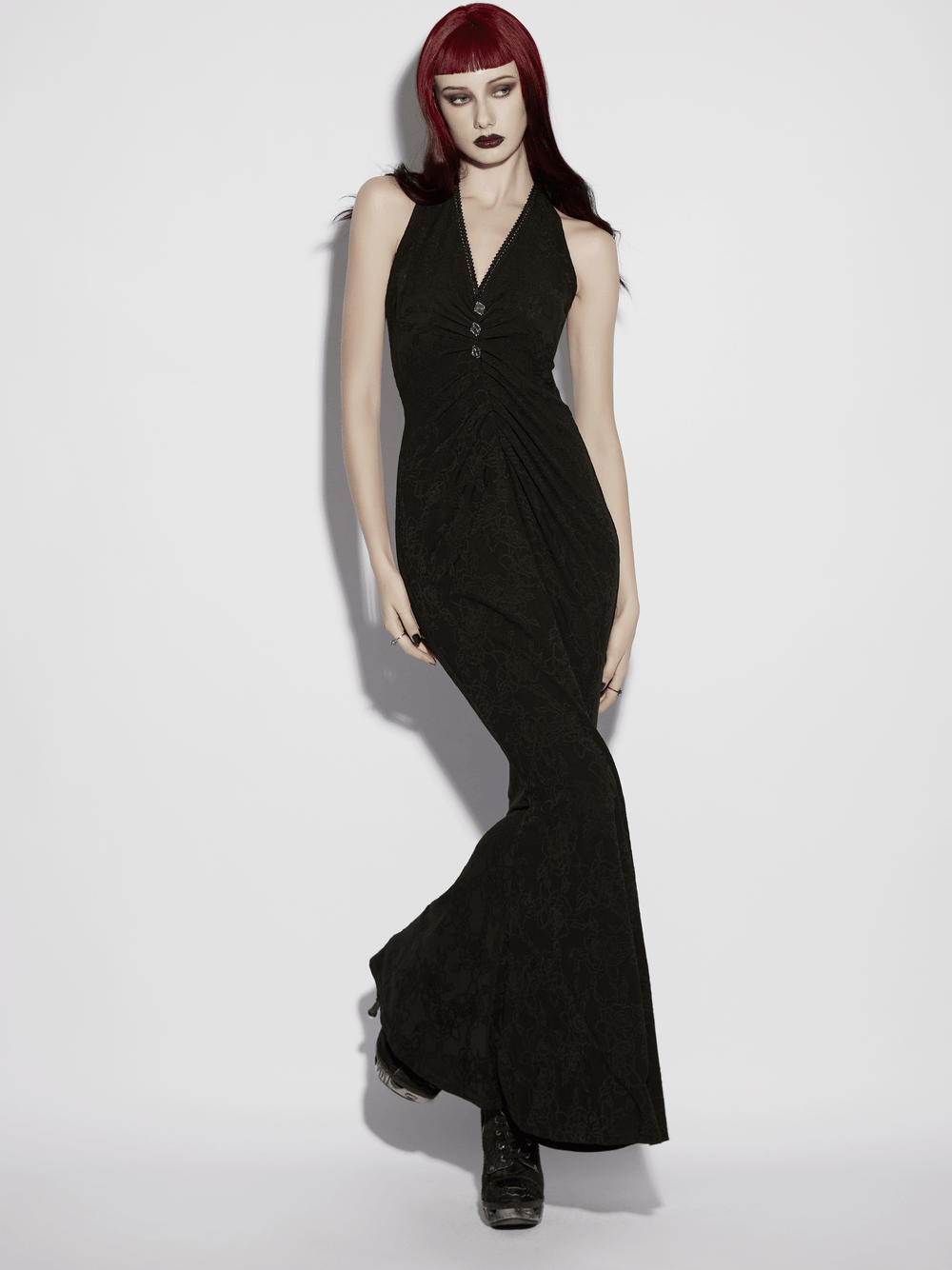 Alt Tag: Black Gothic Halter Jacquard Mermaid Maxi Dress on model, black halter neck fishtail maxi gown with ruched waist and metal buckle accents