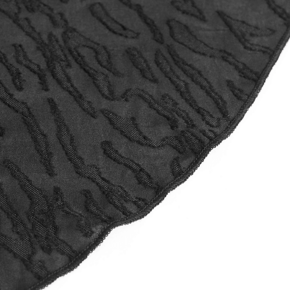 Alt Tag: Black Gothic Halter Neck Top with Asymmetric Hemline close-up of distressed black mesh with animal print texture and edgy hem