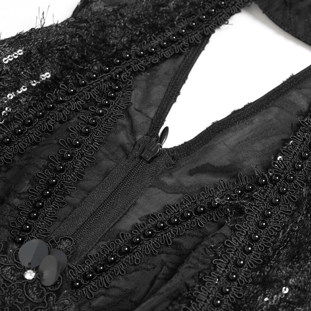 Alt Tag: Black Gothic Halter Neck Top with Asymmetric Hemline close-up, distressed mesh with bead trim and zipper detail