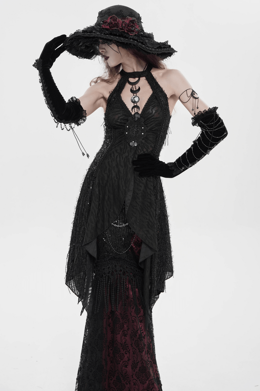 Black Gothic Halter Neck Top with Asymmetric Hemline worn as sleeveless punk vest with distressed mesh, beads, shredded hem at festival