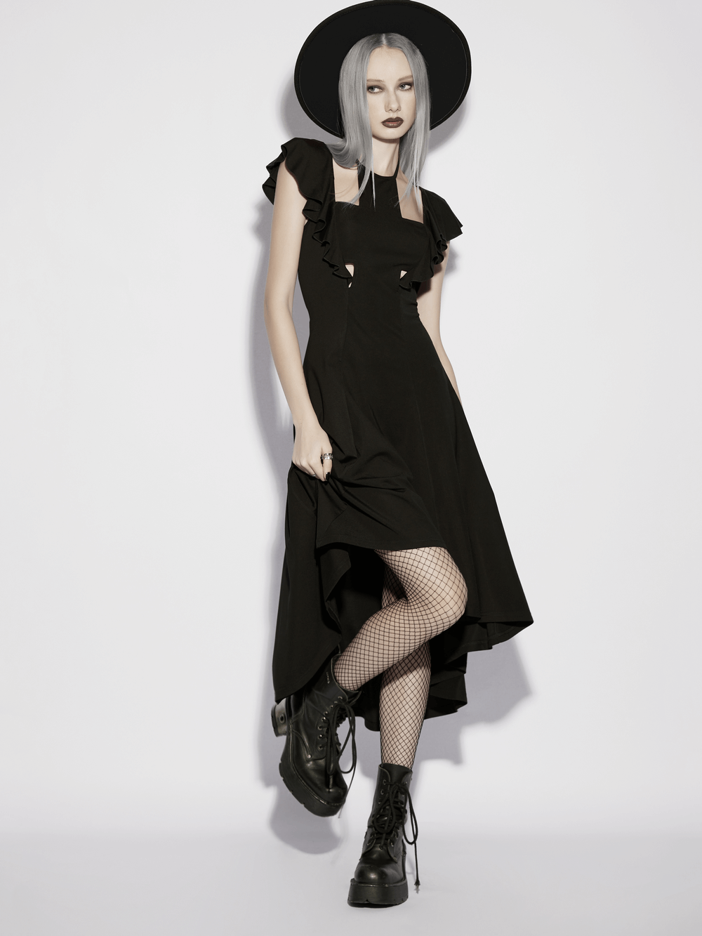 Alt Tag: Black Gothic High Low Dress with Ruffle Sleeves on model, black high-low hem, ruffle sleeves, lace-up back gothic outfit