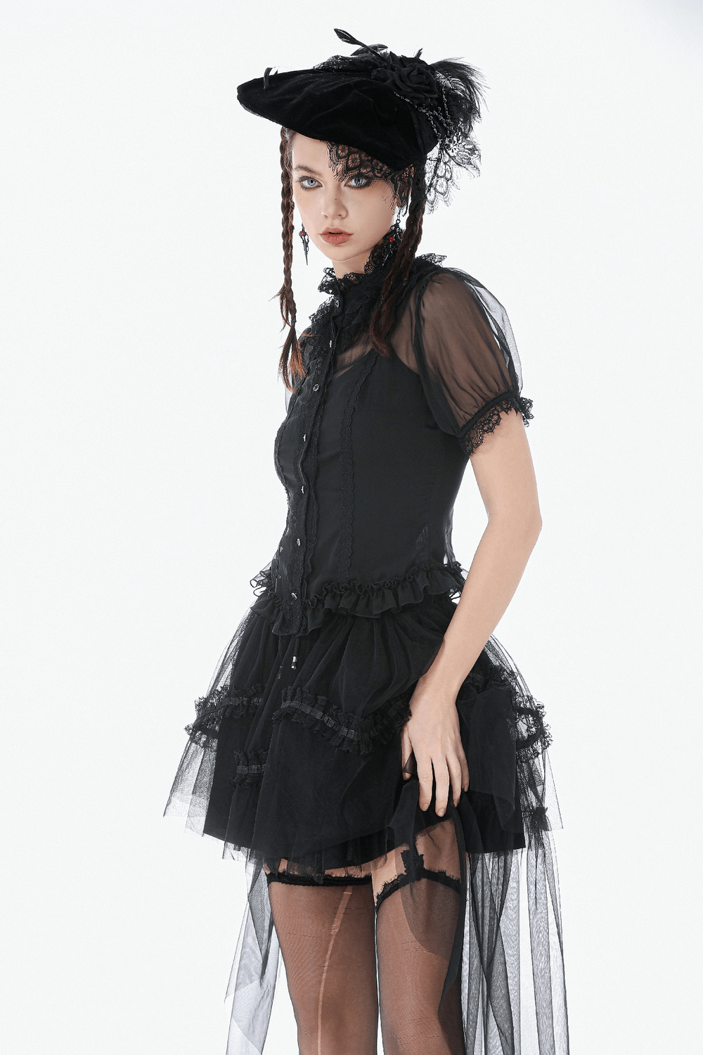 Black Gothic High Low Skirt with Layered Ruffles worn with a stylish hat, showcasing dramatic volume and a gothic silhouette.