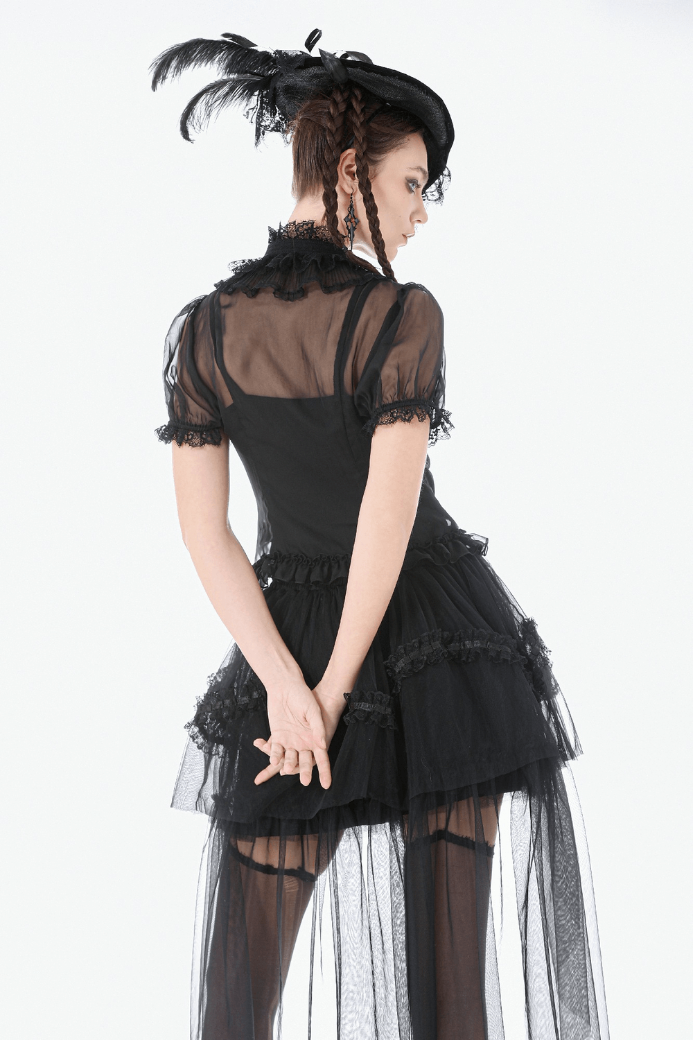 Black Gothic High Low Skirt with Layered Ruffles worn by model showcasing dramatic ruffles and sheer layers.