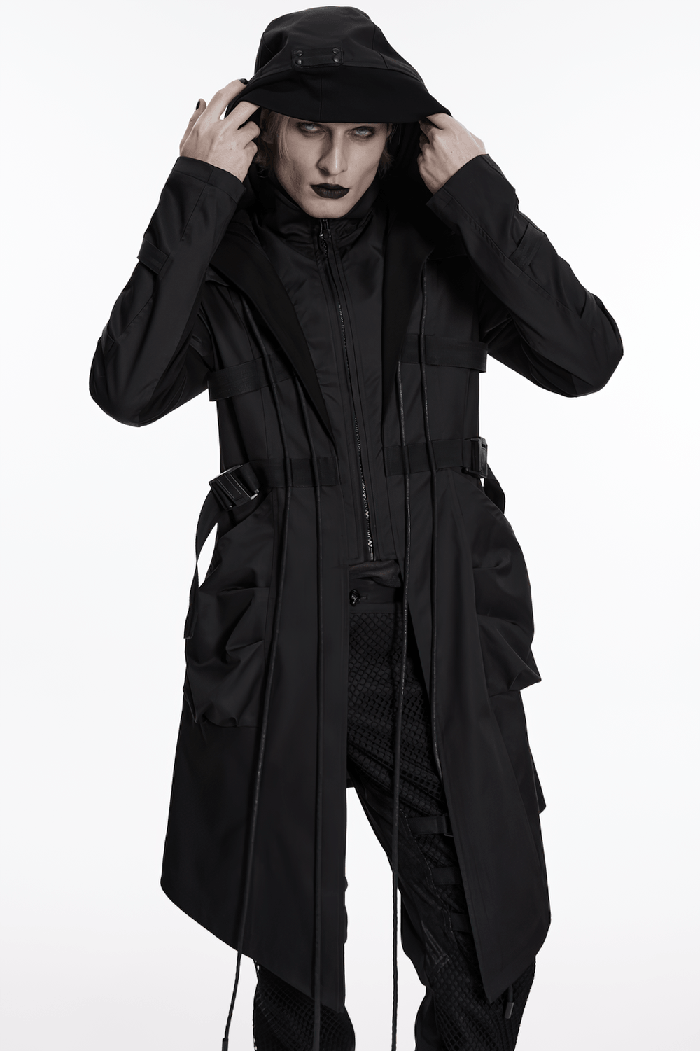 Black Gothic Hooded Coat with Tactical Strap Details worn with drawstrings and pockets, showcasing a bold cyber-gothic style.