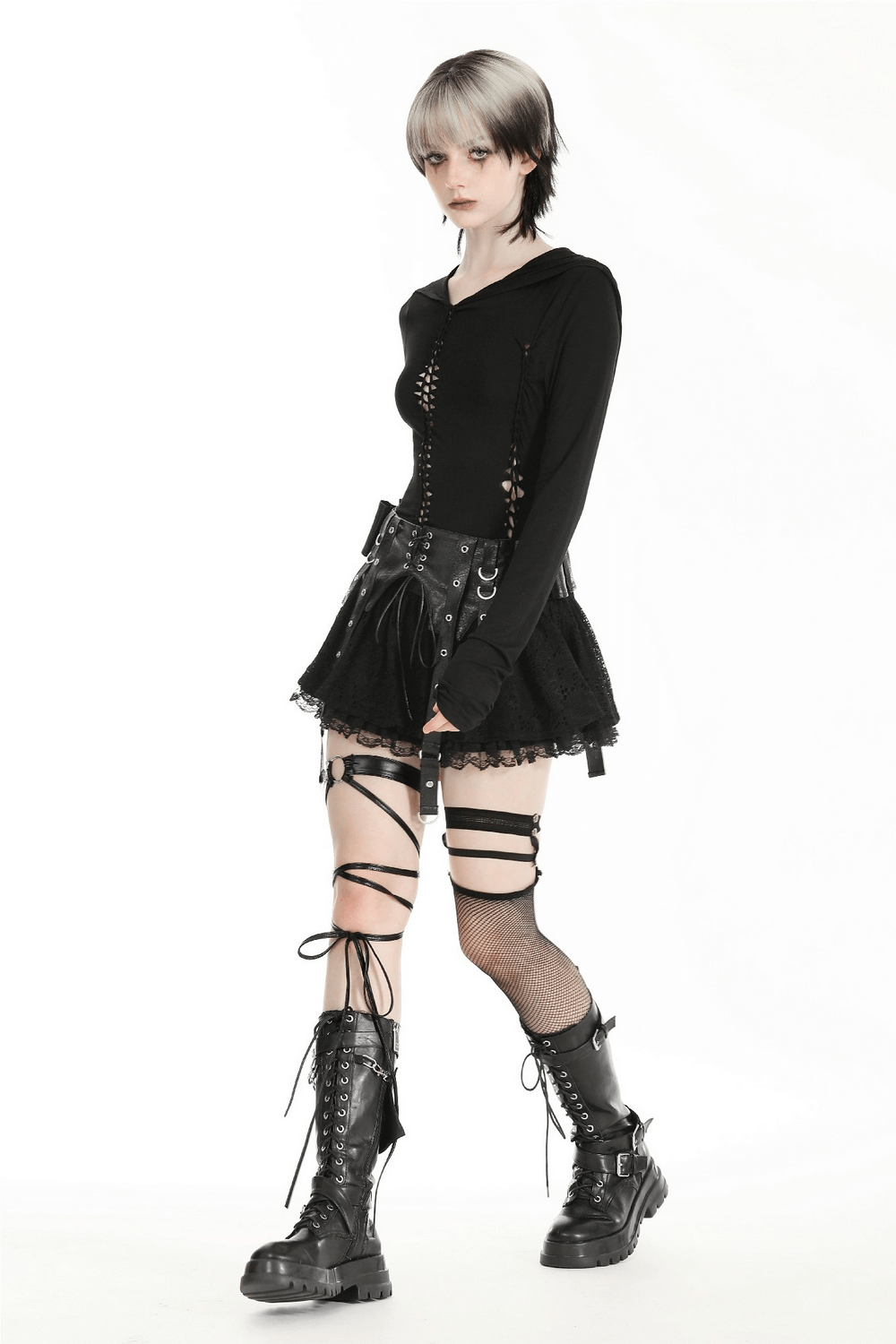 Model wearing a black gothic hooded long sleeve top, layered with a skirt, showcasing edgy alternative fashion.