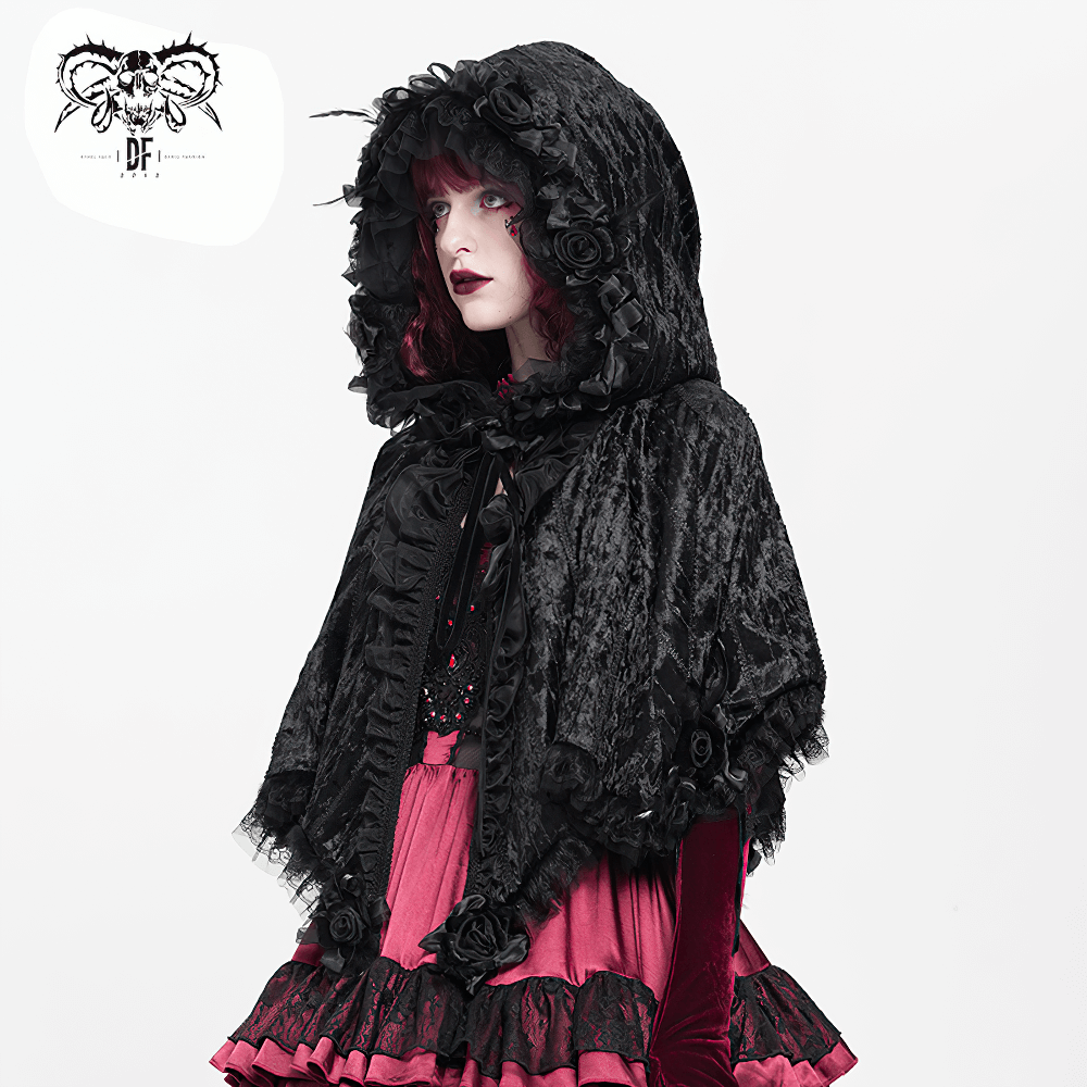 Black Gothic Hooded Lace Cape with Rose Details worn by a model, showcasing velvet fabric and lace accents.