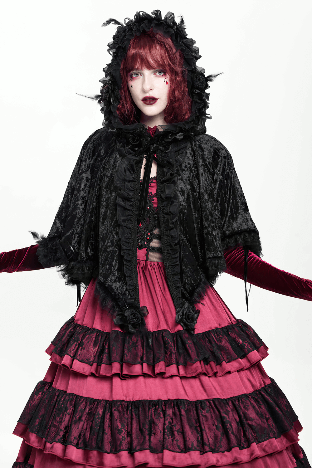 Black Gothic Hooded Lace Cape with Rose Details worn over a layered pink dress, showcasing its Victorian elegance and velvet charm.