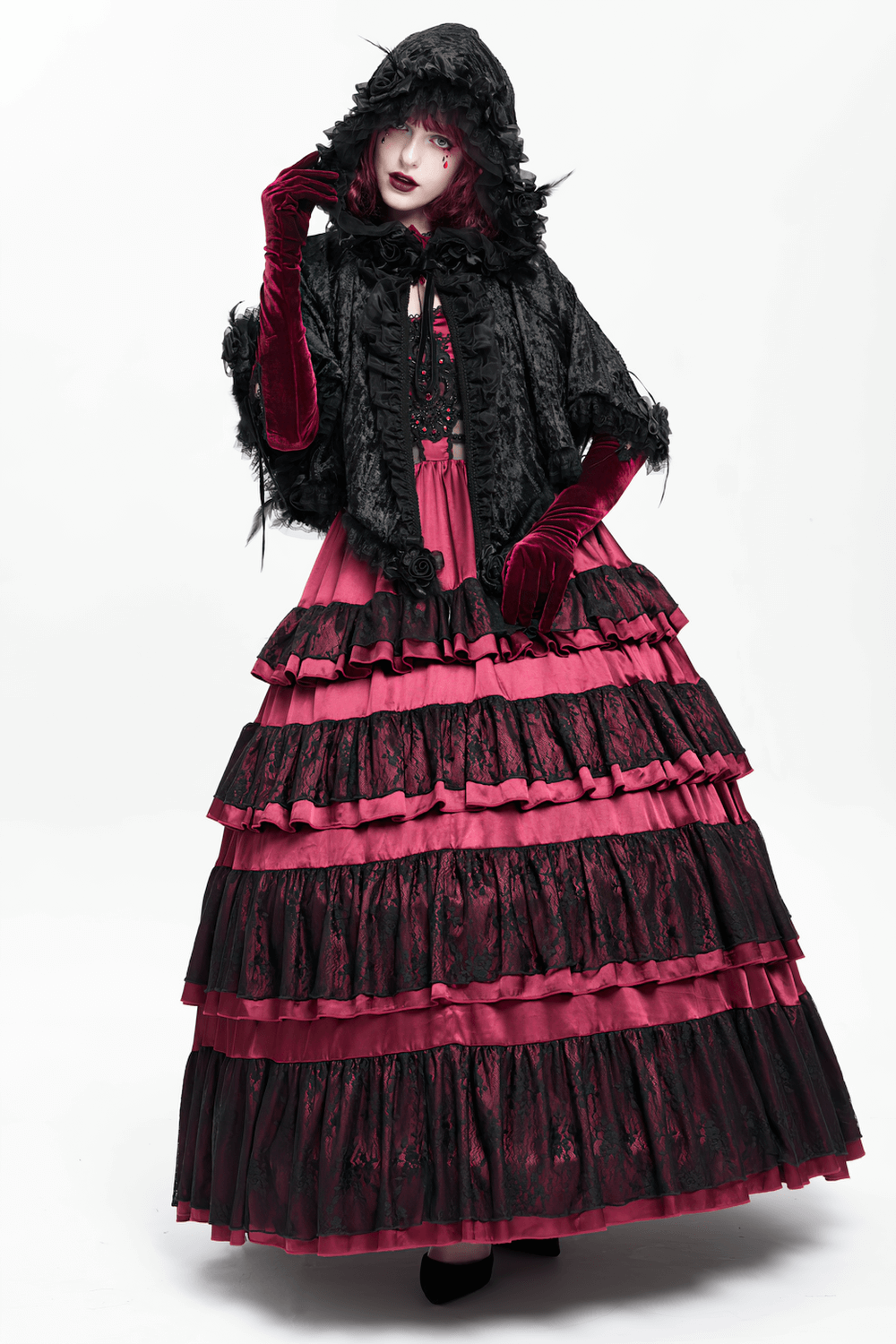 Black Gothic Hooded Lace Cape with Rose Details, featuring velvet, lace trim, and dramatic hood paired with a ruffled dress.