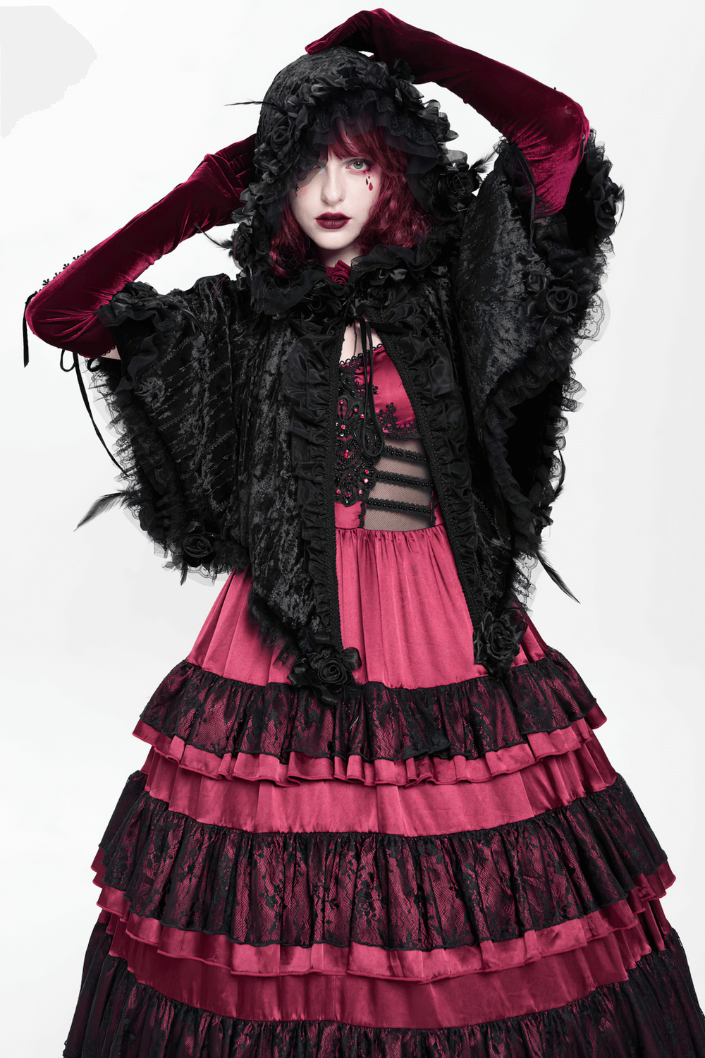 Black Gothic Hooded Lace Cape with Rose Details worn by model in dramatic pose, showcasing Victorian elegance.