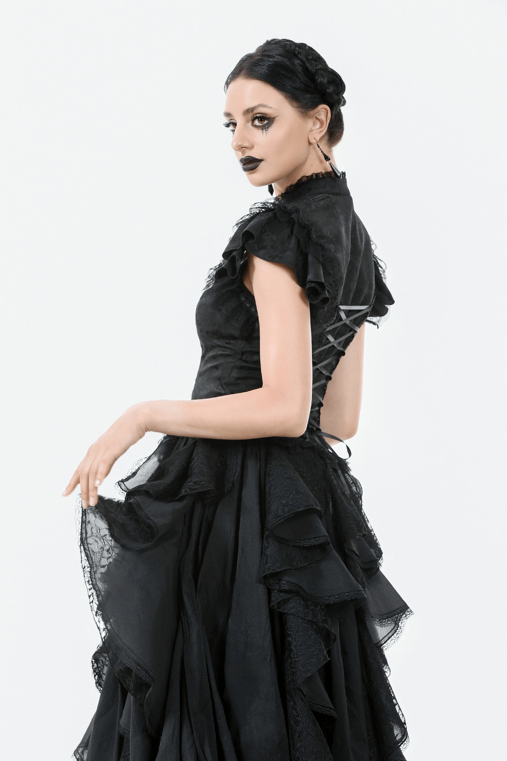 Gothic black jacquard corset top with puff sleeves, lace trim, and satin back lacing, styled with layered skirt.