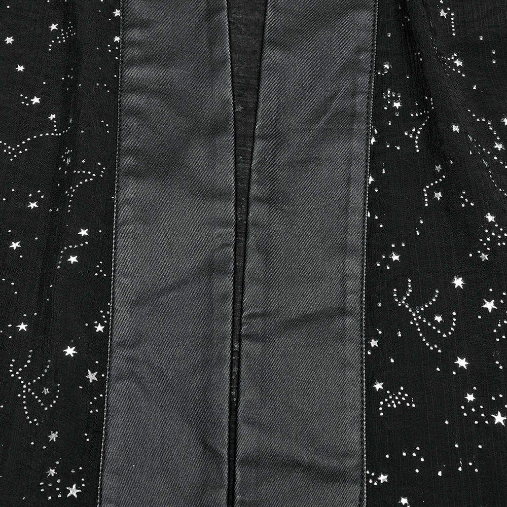 Close-up of black gothic kimono cape featuring starry print and braided waist tie, showcasing celestial patterns.