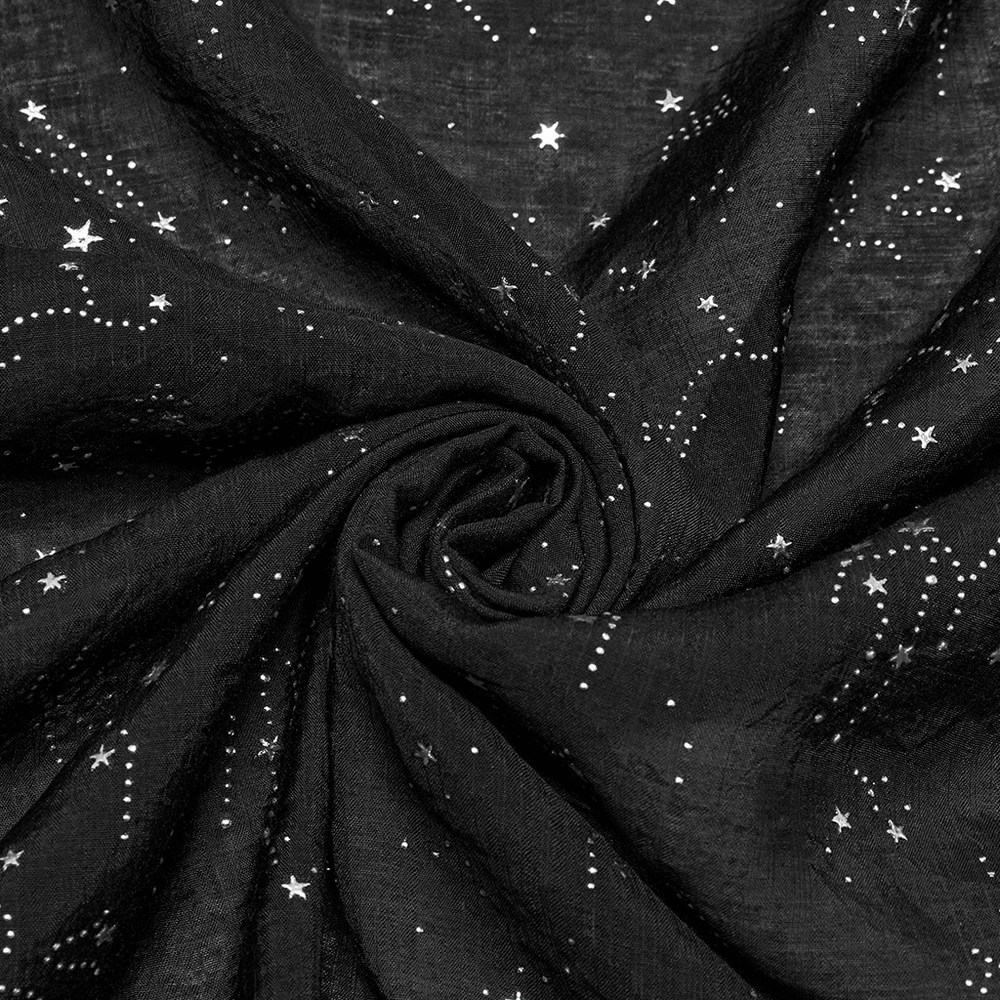 Close-up of black fabric with silver starry celestial print, featuring swirling designs for a gothic cape.