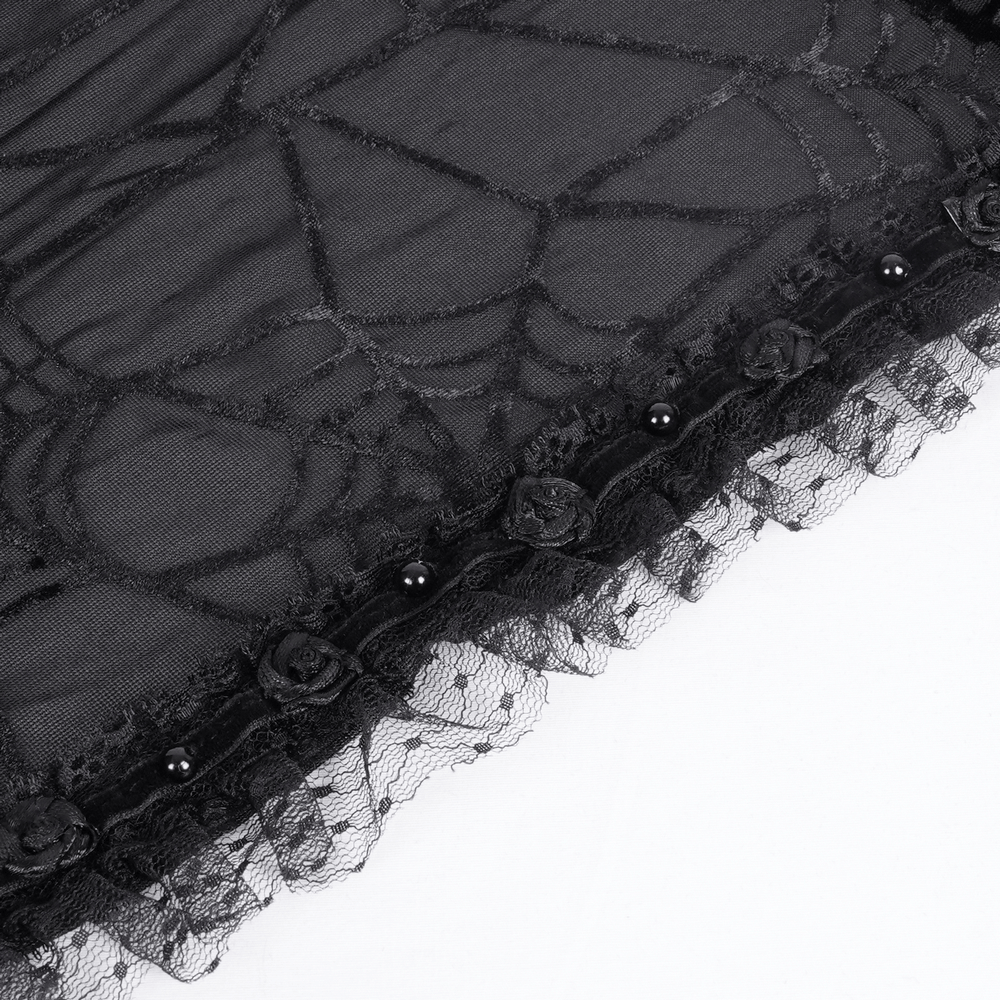 Close-up of black gothic lace fabric with spiderweb pattern and floral details, perfect for elegant costume parties.