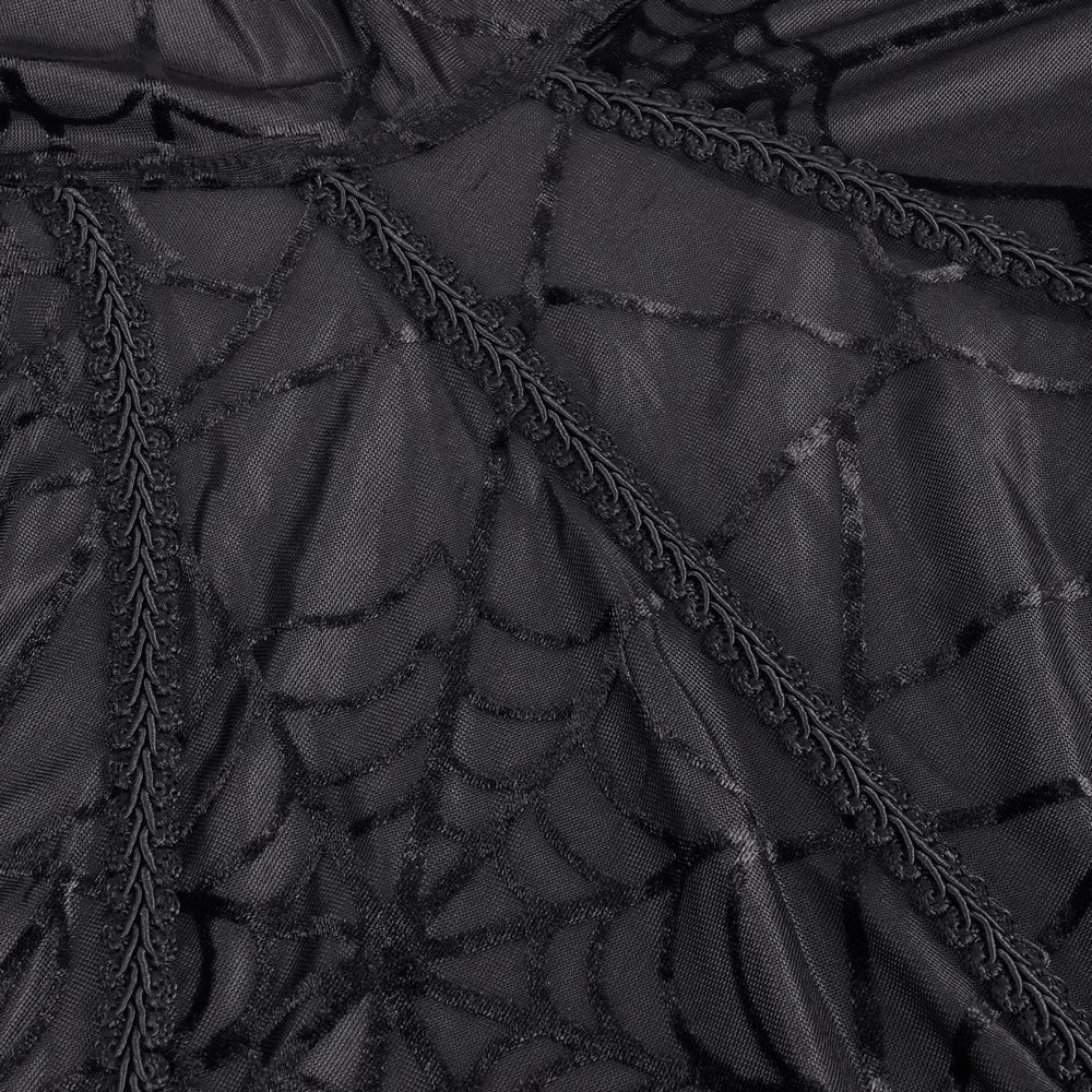 Close-up of black gothic lace fabric with spiderweb pattern, perfect for creating a dramatic and mysterious look.