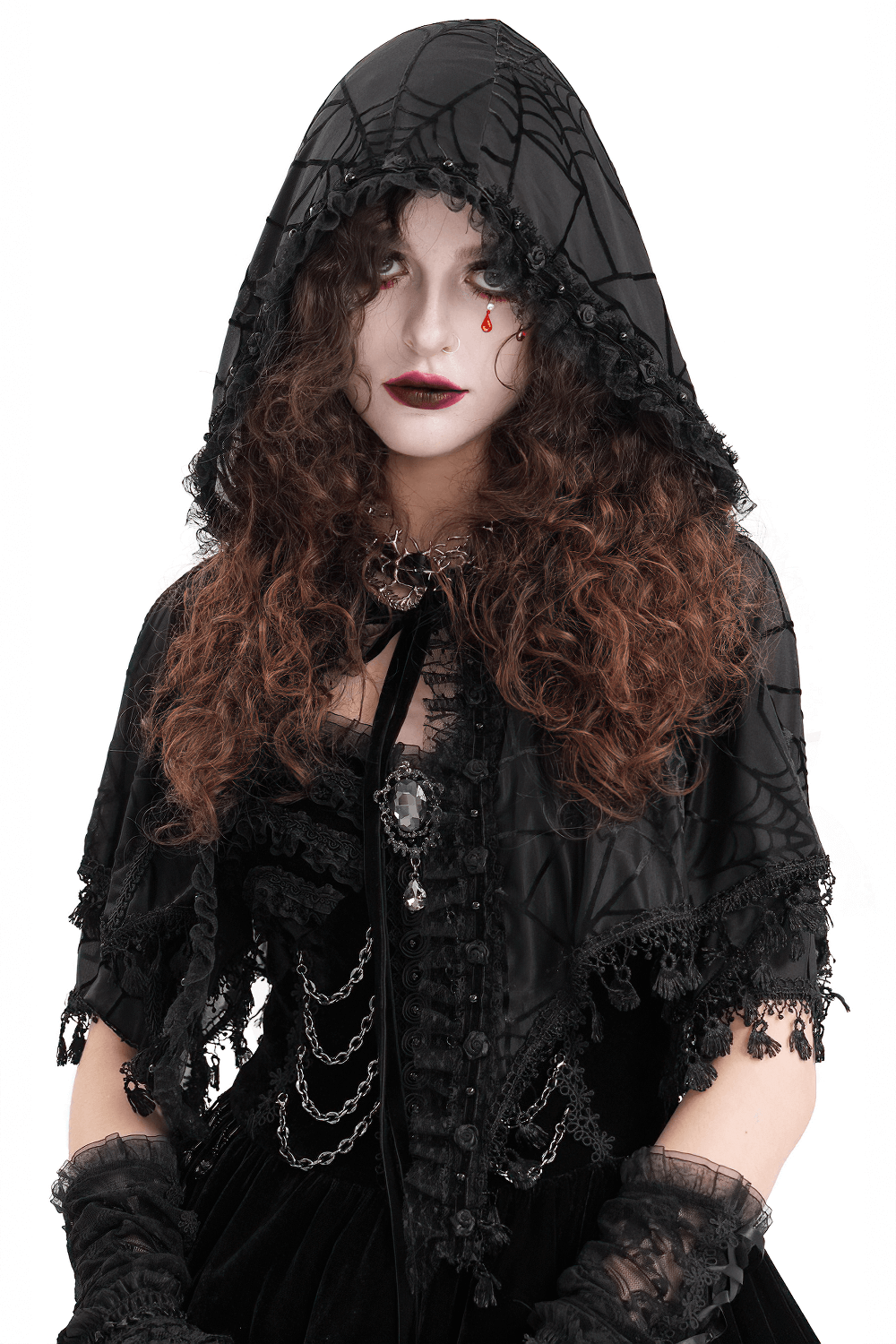 Woman in a spooky black gothic lace cape with hood and spiderweb pattern, perfect for Halloween and costume events.