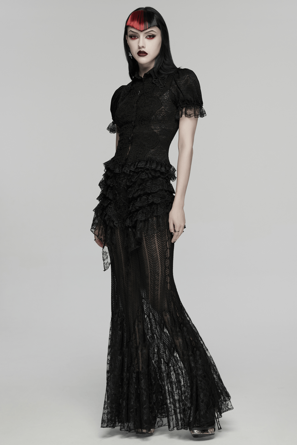 Alt Tag: Black Gothic Lace Corset Blouse with Puff Sleeves on model, sheer floral lace, Victorian lacing, puff sleeves, ruffled trims