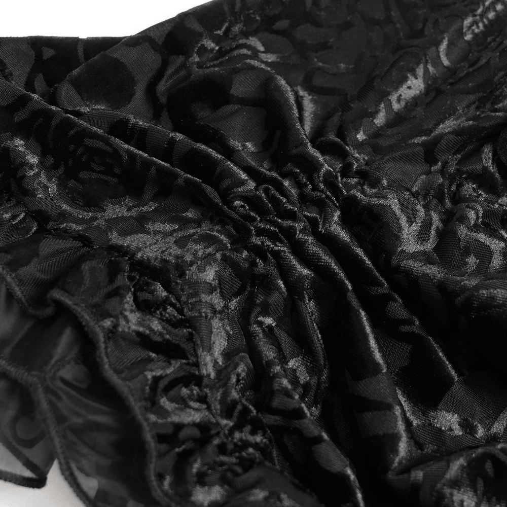 Alt Tag: Black Gothic Lace Corset Top with Sheer Ruffle Sleeves close-up of black floral lace fabric and gathered ruffle detail