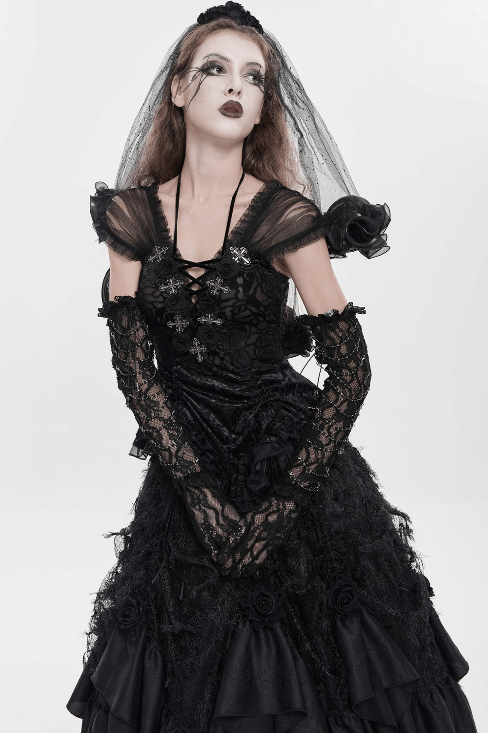 Alt Tag: Black Gothic Lace Corset Top with Sheer Ruffle Sleeves on model, floral lace bodice, cross accents, sheer ruffle sleeves, veil