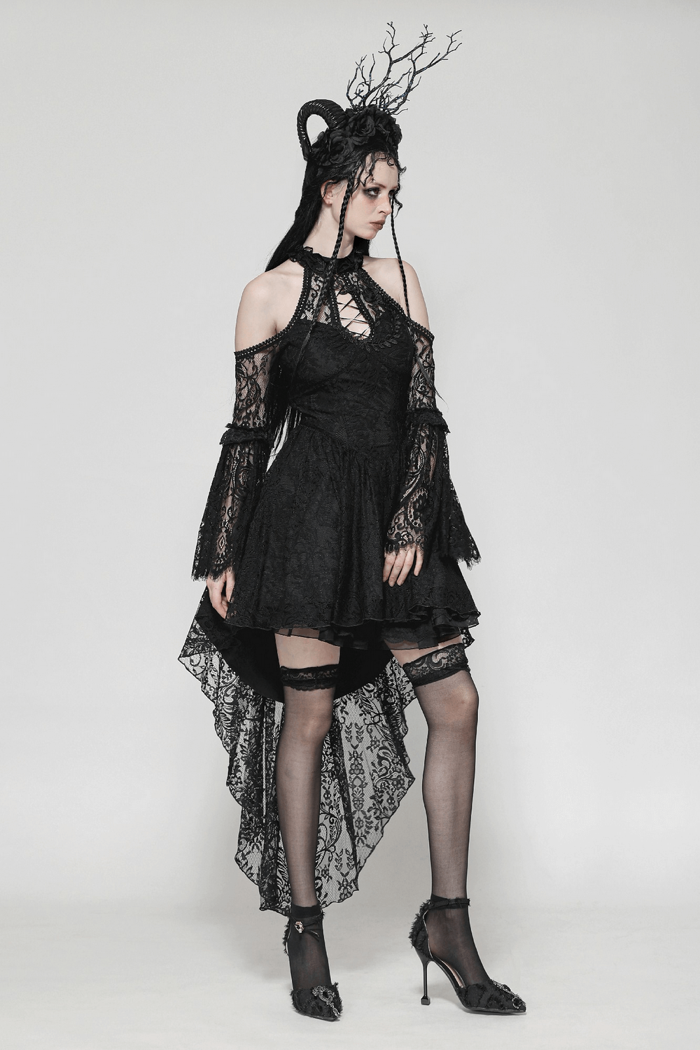 Black gothic lace dress with heart details, open shoulders, ruffles, and dramatic high-low hemline.