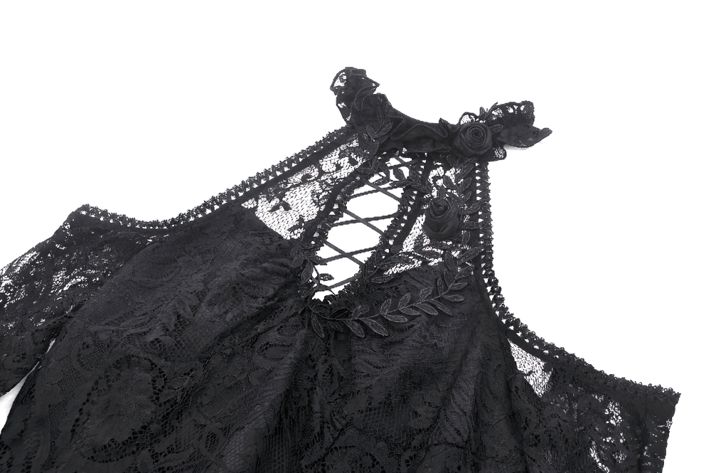 Close-up of a black gothic lace dress featuring a lace-up back, heart details, and ruffled trim for a dramatic look.